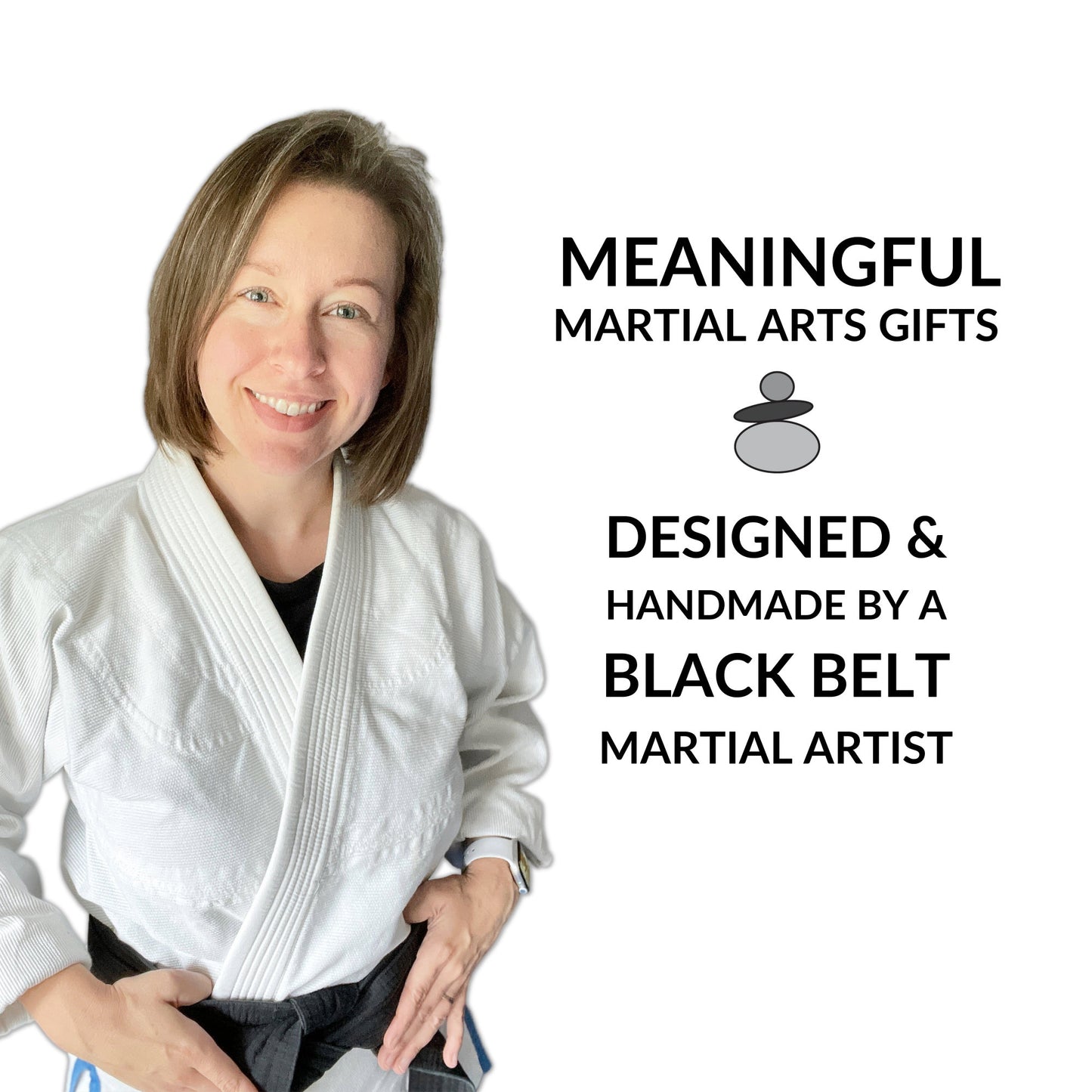 image is of a female in a white martial arts gi and black black. she is smiling and has shoulder length brunette hair.